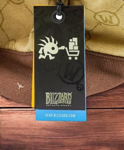 Blizzard Entertainment hang tag with logo and shopping cart design on a textured background